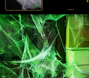 Glow-in-the-dark green spider web with small spiders for Halloween wall decoration