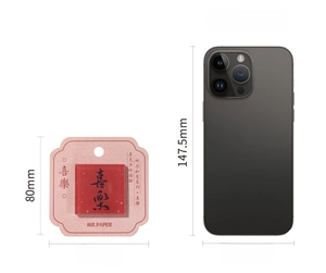 Detailed size comparison of acrylic fridge magnet with Xile calligraphy and iPhone 14 Pro