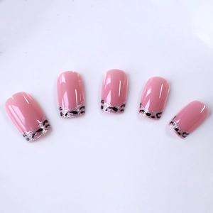 Classic French leopard print press-on nails with pink glitter and a glossy nude finish