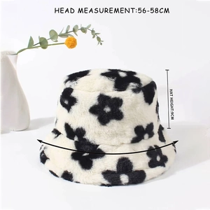 Detail view of plush flower bucket hat showing 56-58cm head measurement and soft texture