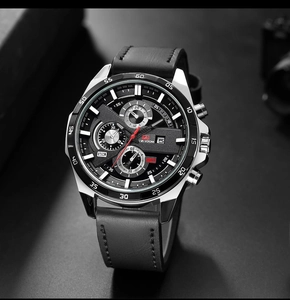 Detail of LIGE VOOM chronograph watch with black leather strap and red dial accents