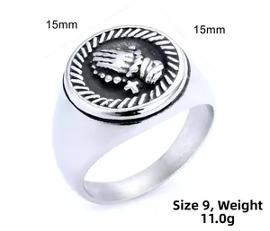 Detailed close-up of 15mm stainless steel signet ring with praying hands relief