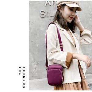 Fashionable dark purple nylon crossbody phone bag with multi-layer zipper and adjustable strap