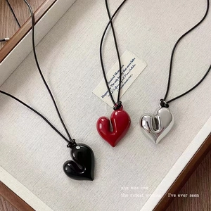 Minimalist adjustable heart pendant necklace set in black, red and metallic silver colors