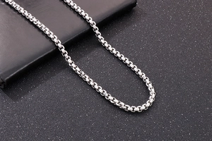 Detail of silver box chain necklace for men with high polished stainless steel finish