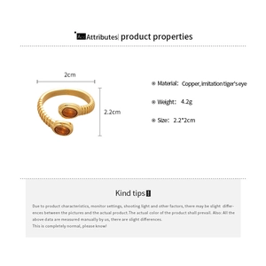 Detail view of oval tiger's eye ring specifications with copper material and size measurements