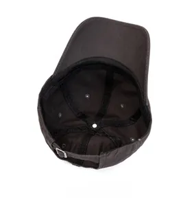 Internal view of a washed baseball cap showing stitched panels and metal back buckle