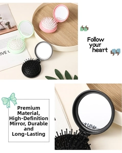 Detail of portable mini folding hairbrush with mirror in pink, mint, and black colors