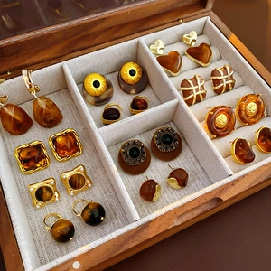 French vintage style amber resin and gold metal earrings set in a wooden jewelry box