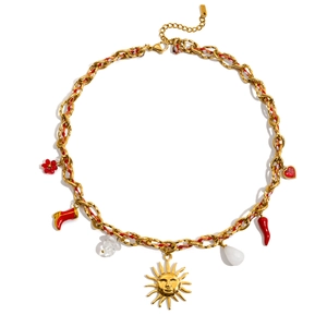 Detail of colorful cord necklace featuring a gold sun face pendant and red charms on white base