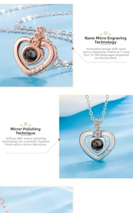 Detail of heart projection necklace with I Love You in 100 languages nano engraving