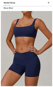Detail von marineblauem Sport-BH und hoch taillierten Crossover-Gym-Shorts am Model