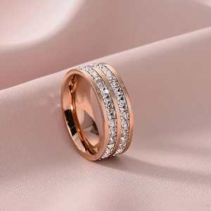 Rose gold double row square cz eternity ring on soft pink satin silk background