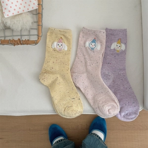 Detailed view of three pairs of pastel cotton crew socks with cartoon bear embroidery