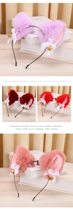 Close-up of plush rabbit ears hair hoop with satin bows and golden bells detail