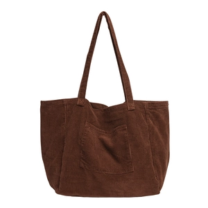 Deep brown corduroy tote bag with large capacity and exterior pocket on white background