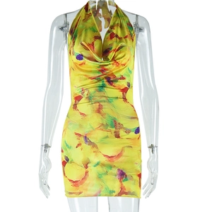 Detail of yellow abstract print halter dress with slim fit and cowl neck design