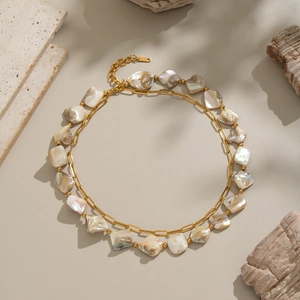 Elegant gold layered necklace with irregular natural shell beads and stainless steel chain