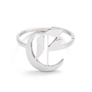 Detailed view of silver gothic K letter ring with polished metallic finish for women