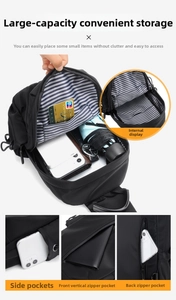 Detail view of black nylon chest bag with blue striped lining and multi-functional compartments