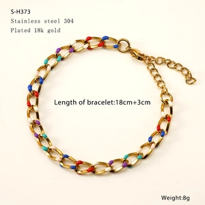 Detailed view of colorful enamel Cuban link bracelet in 18k gold-plated stainless steel