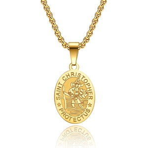 Detailed macro view of gold St. Christopher pendant with embossed religious motif and box chain