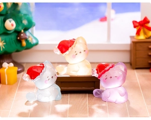 Miniature resin luminous Christmas cats in pastel colors within a cozy dollhouse scene