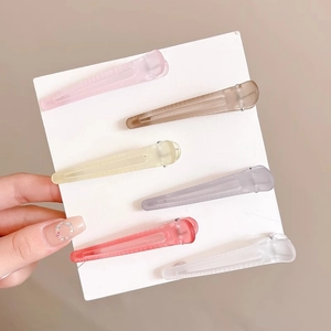 Set of six colorful matte hair clips on card for volume and styling hair