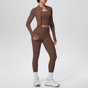 Detail of high-waisted yoga set with compression fabric and slim fit zip jacket