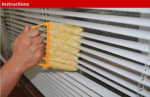 Detail of 7-layer yellow microfiber cleaner brush cleaning white window blinds