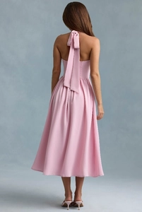 Pink halter backless dress featuring elegant long bow ties and a flowing A-line silhouette