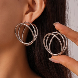 Three-layer silver hollow twisted round hoop earrings with elegant geometric metal design