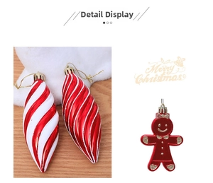 Detail of red and white spiral cone ornament and gingerbread man with golden strings