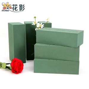 Stack of high-density green floral foam bricks for flower arrangements and preservation