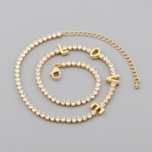 Gold-plated LOVE charm necklace featuring clear cubic zirconia and adjustable lobster clasp