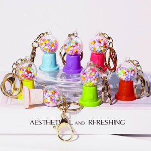 Colorful candy machine keychains set in macaron colors with metal rings and foam beads