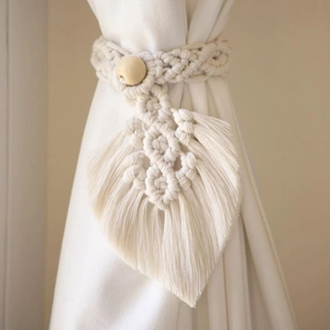Bohemian beige cotton rope curtain tieback featuring a large leaf design and wood bead