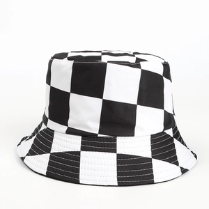 Detailed view of black and white checkered pattern on a canvas bucket hat for women