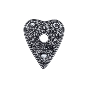 Gothic silver planchette brooch featuring skull and sun moon embossed patterns