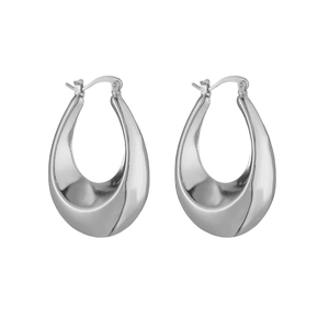 Macro detail of silver geometric water drop earrings with high-polish metal finish