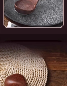 Close-up of seamless ebony wood soup ladle showing smooth polished grain and curved handle