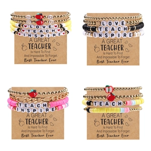 Colorful clay teacher bracelets set with TEACH and INSPIRE letters on kraft cards