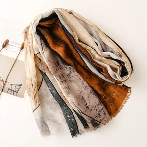Detail of abstract ink print scarf with soft texture and natural fringe edges