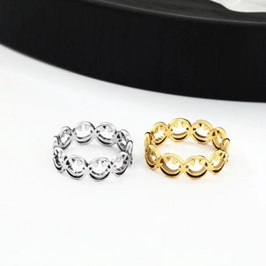 Fashionable stainless steel rings with laser-cut smiley faces in gold and silver finish
