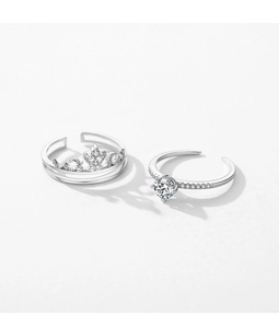 Macro shot of silver S925 crown ring set with shimmering diamonds and adjustable open band