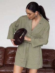 Detail of sage green waffle knit shirt set showing relaxed fit and soft texture