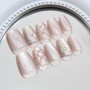 Pink cat eye press-on nails set with 3D diamond bow and metallic pearl accents