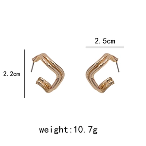 Detail view of irregular gold geometric earrings with dimensions 2.5cm by 2.2cm