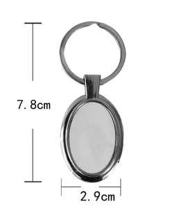 Detailed view of silver oval metal keychain with 7.8cm total length and 2.9cm width dimensions