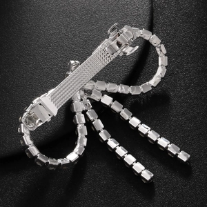 Elegant silver butterfly tassel hair clip with sparkling rhinestones on black background